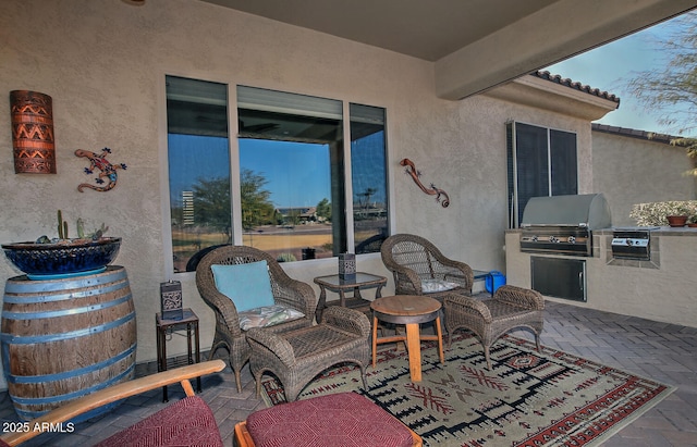 view of patio featuring grilling area and exterior kitchen