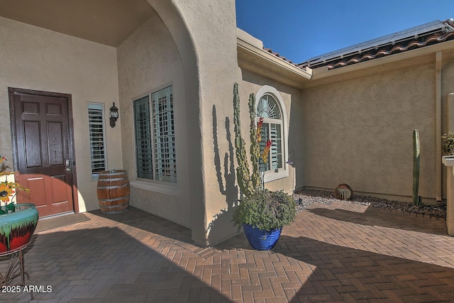 doorway to property with a patio