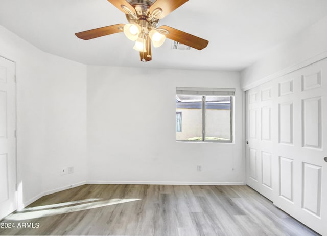 spare room with light wood-type flooring