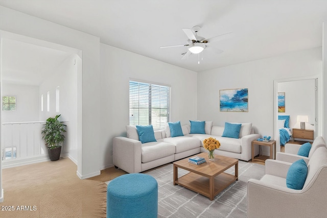 living room featuring ceiling fan and light carpet