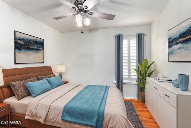 bedroom featuring light hardwood / wood-style floors and ceiling fan