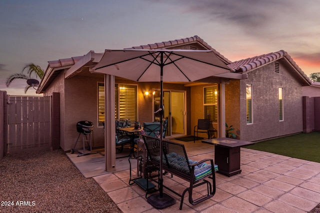 patio terrace at dusk with an outdoor fire pit