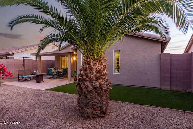 back of property featuring a patio area