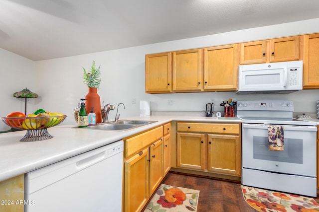 kitchen featuring kitchen peninsula, dark hardwood / wood-style floors, sink, and white appliances