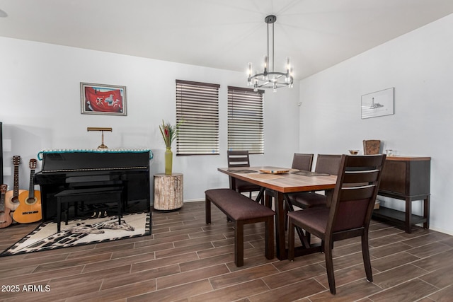 dining area featuring a notable chandelier