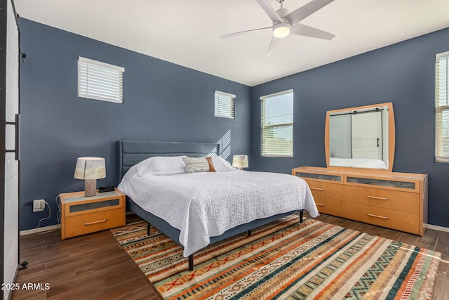 bedroom featuring dark hardwood / wood-style floors and ceiling fan