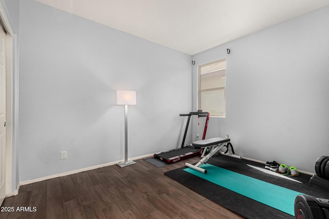 exercise area with dark wood-type flooring