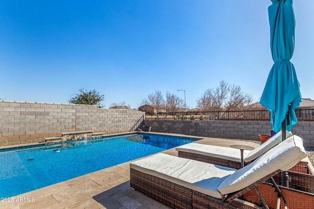 view of pool with a patio and pool water feature