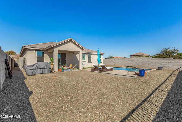 back of house with a patio