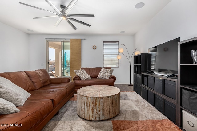 living room featuring hardwood / wood-style flooring and ceiling fan