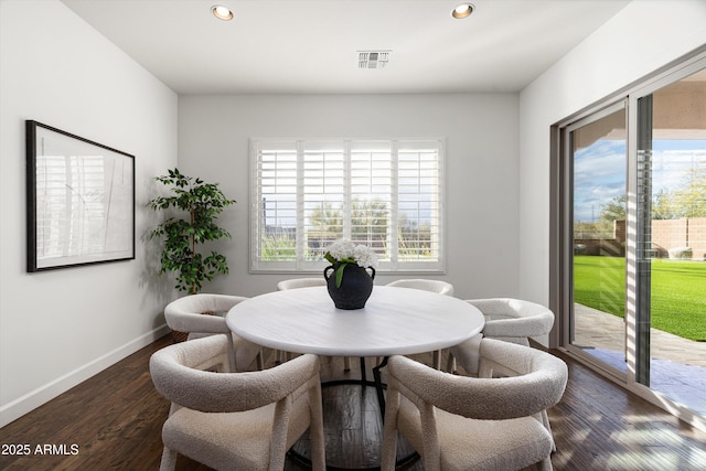 dining space with recessed lighting, wood finished floors, visible vents, and baseboards