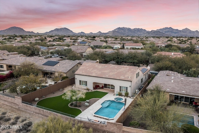 birds eye view of property with a residential view and a mountain view