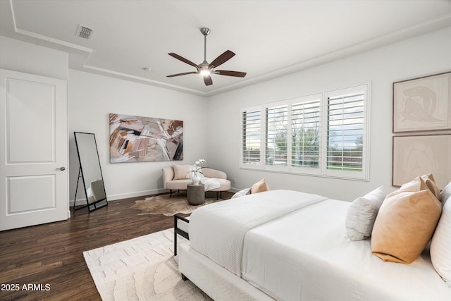 bedroom featuring visible vents, baseboards, ceiling fan, and dark wood-style flooring