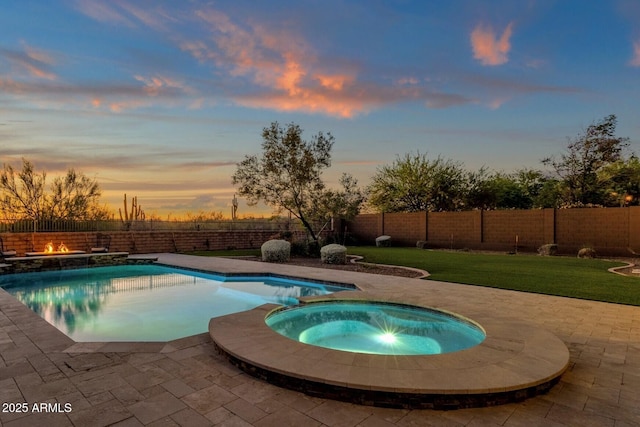 24346 N 72nd Way, Scottsdale, AZ 85255 - view of pool featuring a patio area, an outdoor fire pit, and a pool with connected hot tub