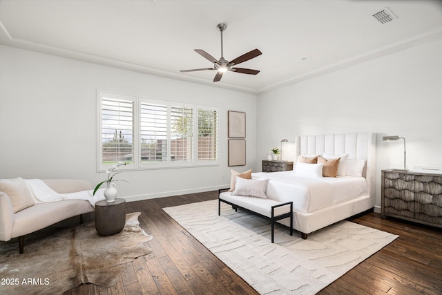 bedroom with a ceiling fan, visible vents, dark wood-style floors, and baseboards