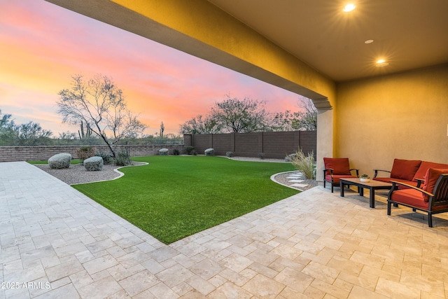 view of yard with a patio area, outdoor lounge area, and a fenced backyard