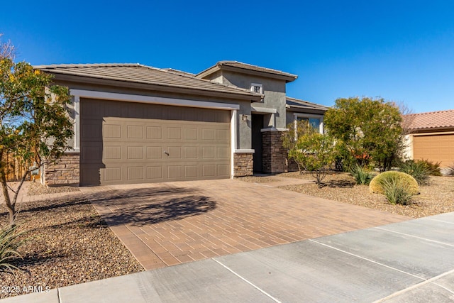 prairie-style home featuring a garage