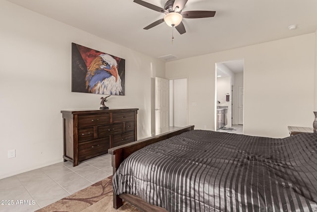 bedroom featuring light tile patterned floors, connected bathroom, and ceiling fan