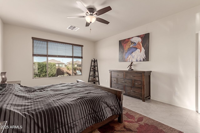 tiled bedroom with ceiling fan