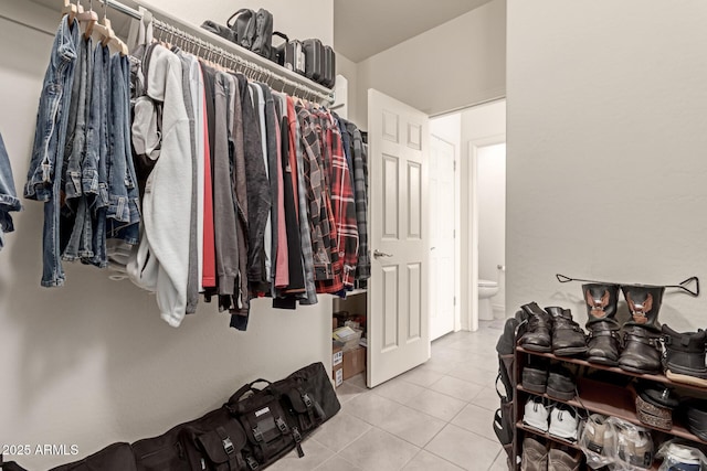 walk in closet featuring light tile patterned floors