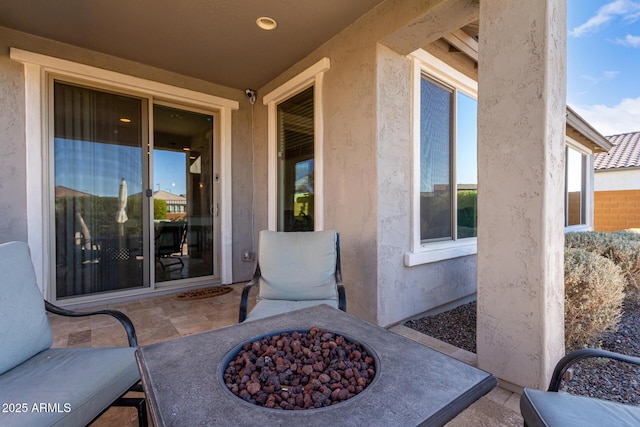 view of patio with an outdoor fire pit