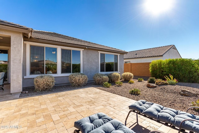 back of house featuring a patio area