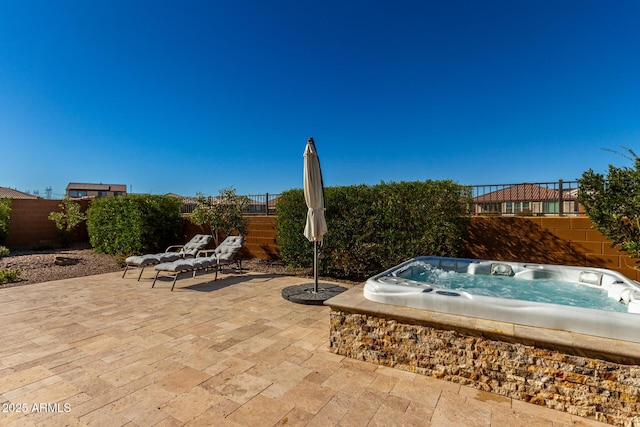 view of patio with a hot tub