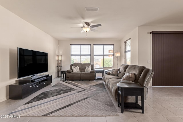 living room with light tile patterned floors and ceiling fan