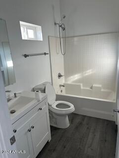 full bathroom featuring tub / shower combination, vanity, toilet, and hardwood / wood-style flooring