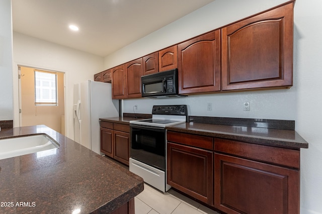15221 N Clubgate Dr Unit 2132, Scottsdale, AZ 85254 - kitchen with a sink, range with electric cooktop, light tile patterned flooring, white refrigerator with ice dispenser, and black microwave