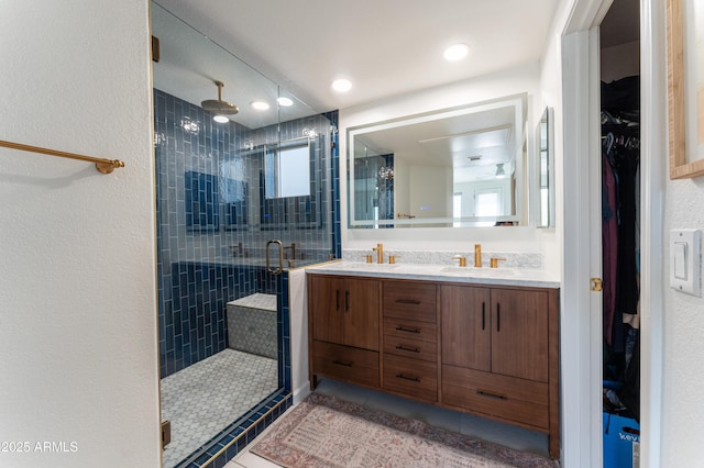15221 N Clubgate Dr Unit 2132, Scottsdale, AZ 85254 - full bathroom with double vanity, a spacious closet, tile patterned flooring, and a stall shower
