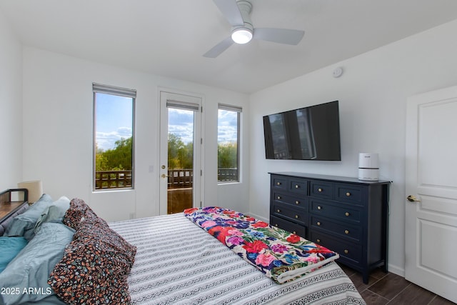 15221 N Clubgate Dr Unit 2132, Scottsdale, AZ 85254 - bedroom featuring ceiling fan, baseboards, dark wood-style flooring, and access to exterior