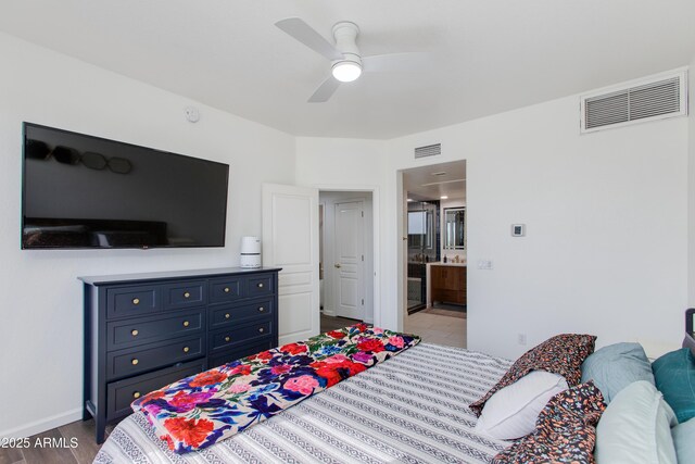 15221 N Clubgate Dr Unit 2132, Scottsdale, AZ 85254 - bedroom featuring baseboards, wood finished floors, visible vents, and ensuite bathroom