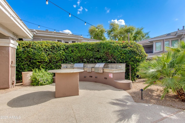 15221 N Clubgate Dr Unit 2132, Scottsdale, AZ 85254 - view of patio / terrace featuring a grill and exterior kitchen