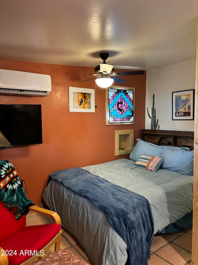 tiled bedroom with ceiling fan and a wall mounted AC