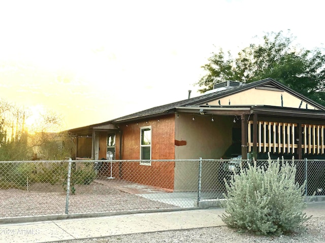 view of property exterior at dusk