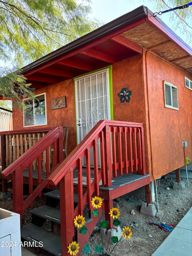 doorway to property with a wooden deck