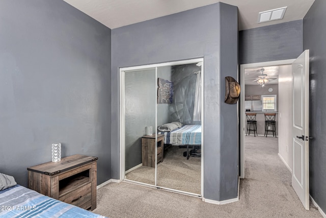 carpeted bedroom with a closet