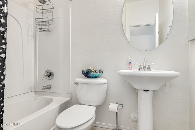 bathroom featuring toilet and shower / bathtub combination