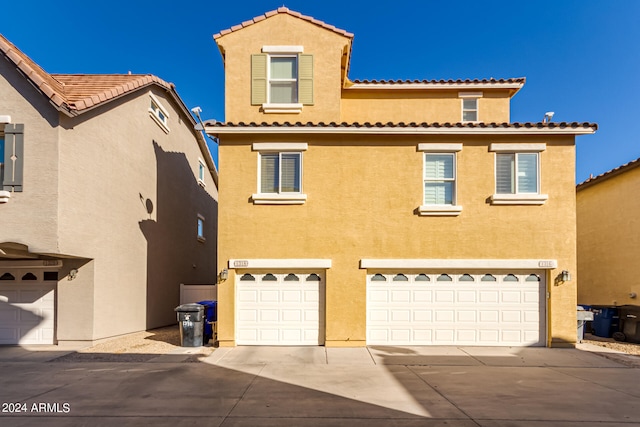 mediterranean / spanish-style home featuring a garage