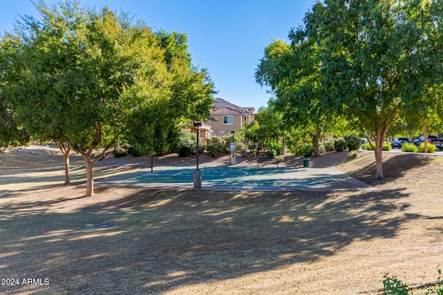 view of swimming pool featuring basketball court