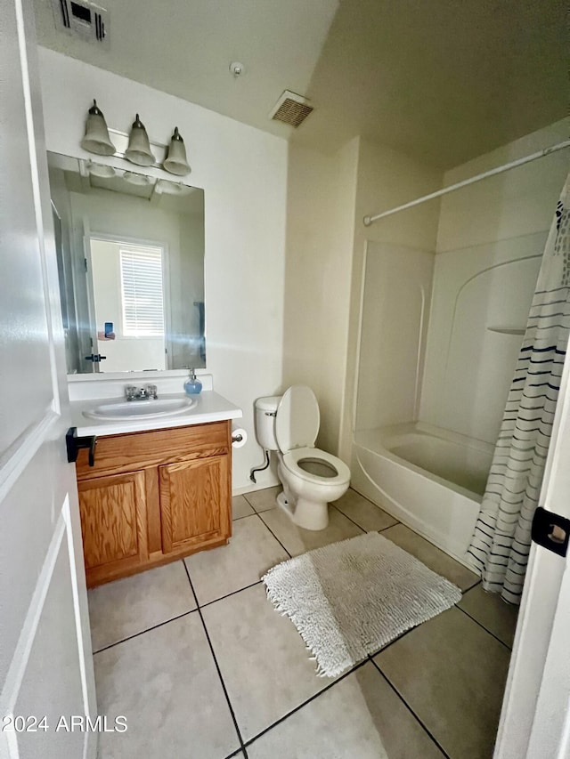 full bathroom with vanity, toilet, tile patterned floors, and shower / tub combo