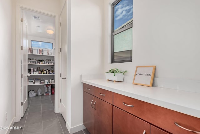 bathroom with tile patterned floors