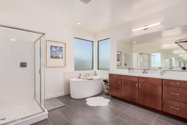 bathroom featuring tile patterned flooring, vanity, and plus walk in shower