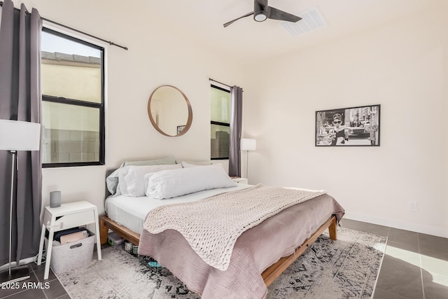 tiled bedroom with ceiling fan