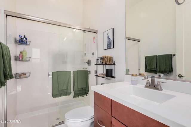 bathroom with vanity, toilet, and walk in shower