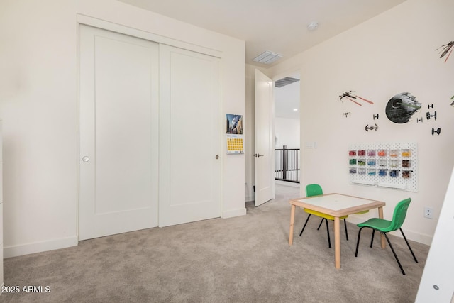 recreation room featuring light colored carpet