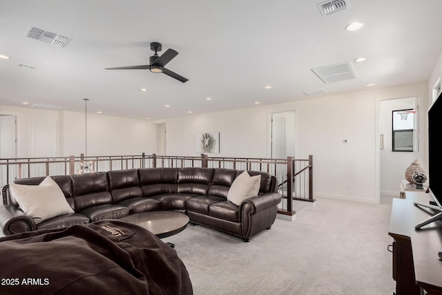 living room with ceiling fan and light carpet