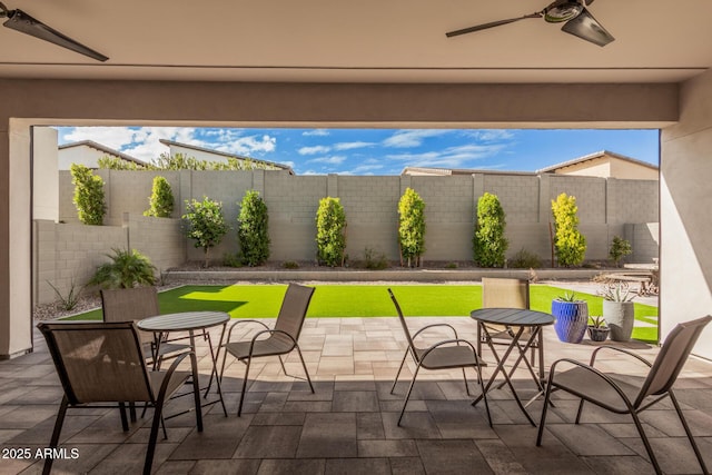 view of patio featuring ceiling fan