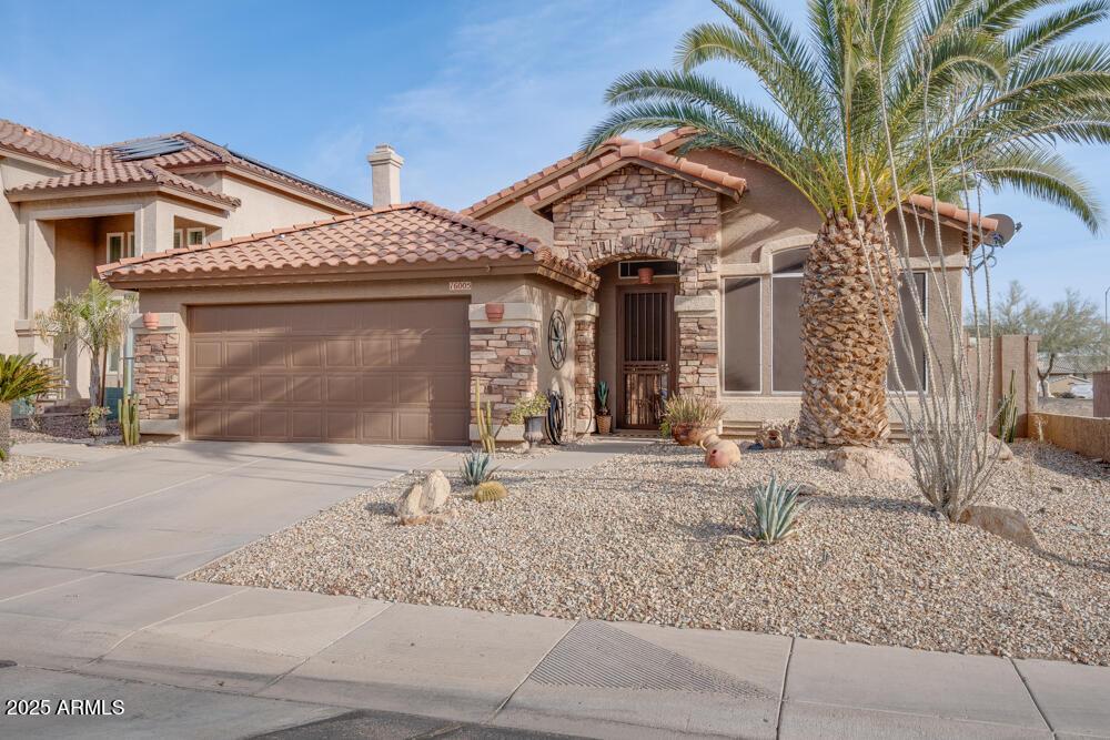 mediterranean / spanish-style home featuring a garage